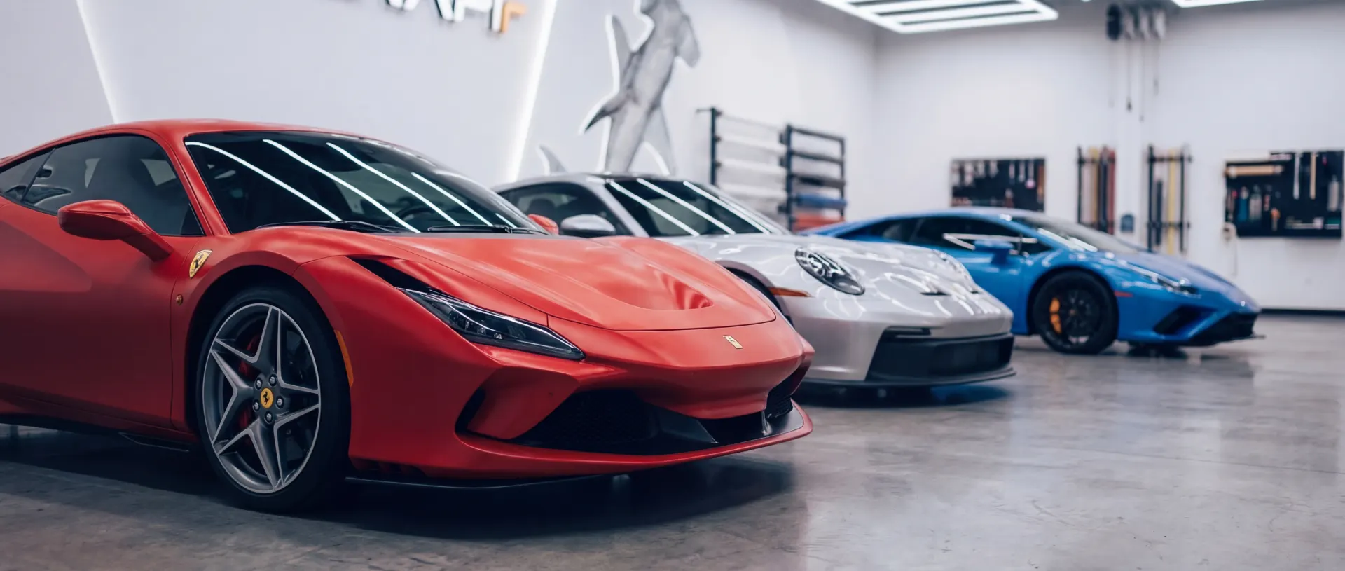 PPF Cost Houston – Transparent Paint Protection Film Pricing Luxury car with professional paint protection film installation in Houston automotive detailing studio showing transparent pricing